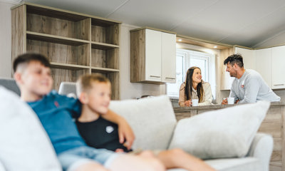 Family relaxing in a lodge on holiday 