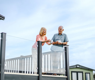 Holiday home Ownership couple on decking