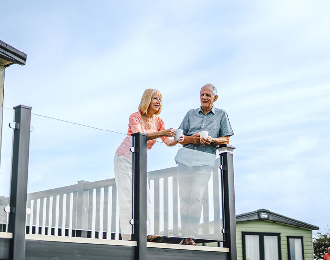 Holiday home Ownership couple on decking