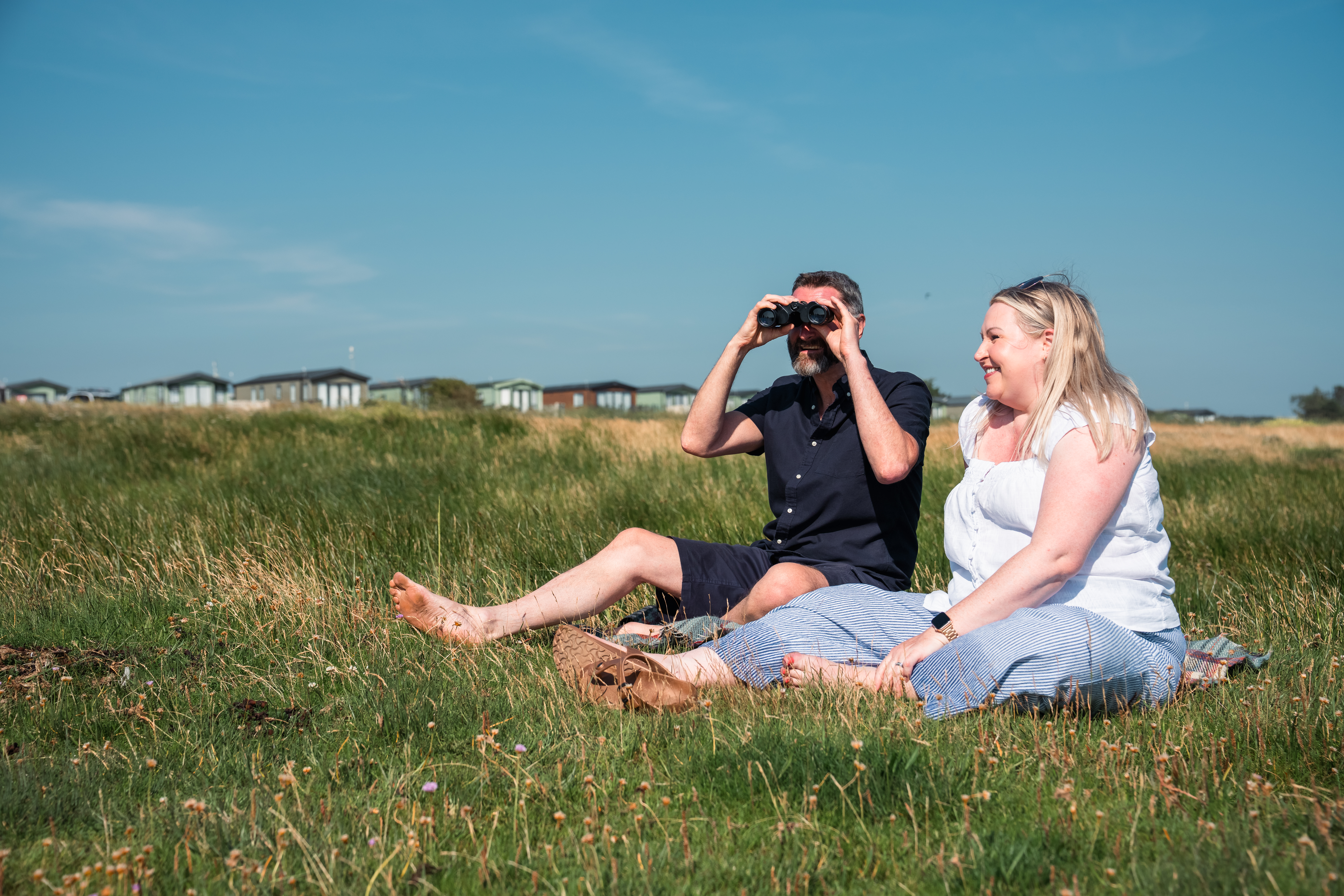 Couple watching wildlife at Queensberry Bay