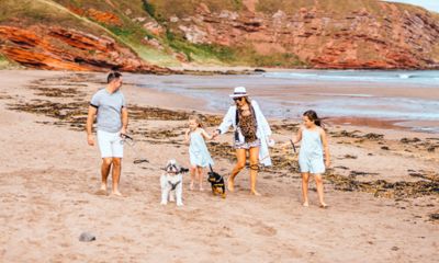 Family on beach with dog