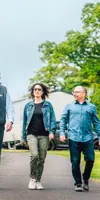 Couple walking with salesman