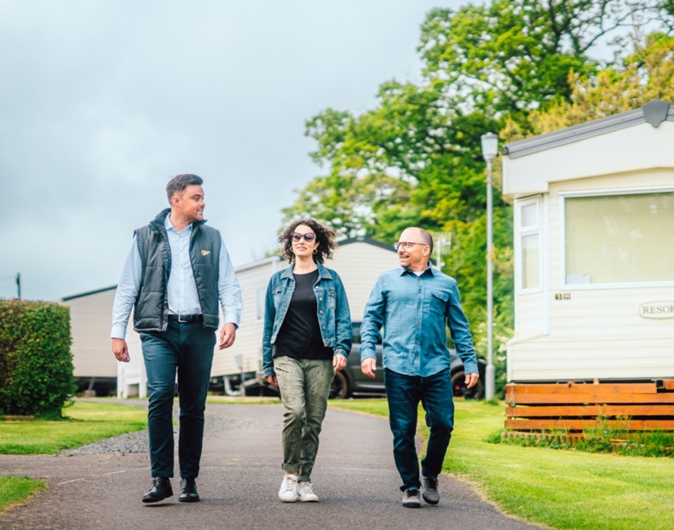 Couple walking with salesman