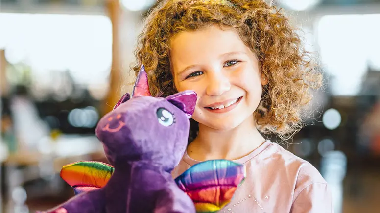 Child with teddy at Golden Coast Leisure Park