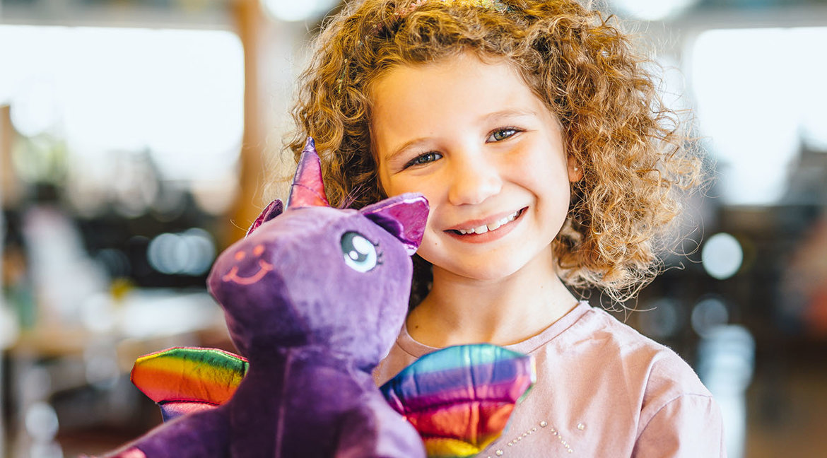 Child with teddy at Golden Coast Leisure Park