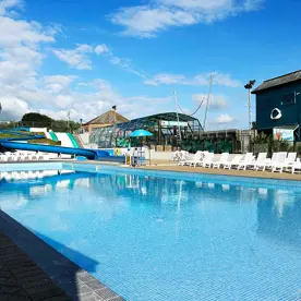 Outdoor swimming pool with slides at Golden Coast