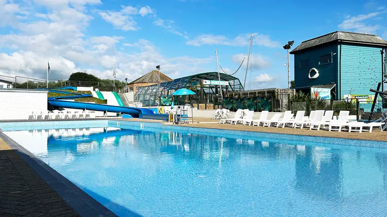 Outdoor swimming pool with slides at Golden Coast