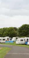Touring vans and motorhomes in a touring field 