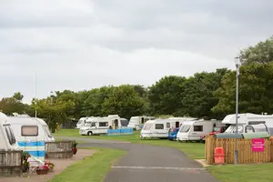 Touring vans and motorhomes in a touring field 