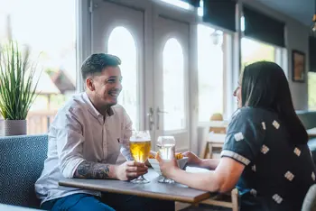 Couple enjoying a drink at Scoutscroft Leisure Park