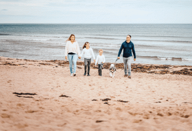 Family and dog on pease bay beach