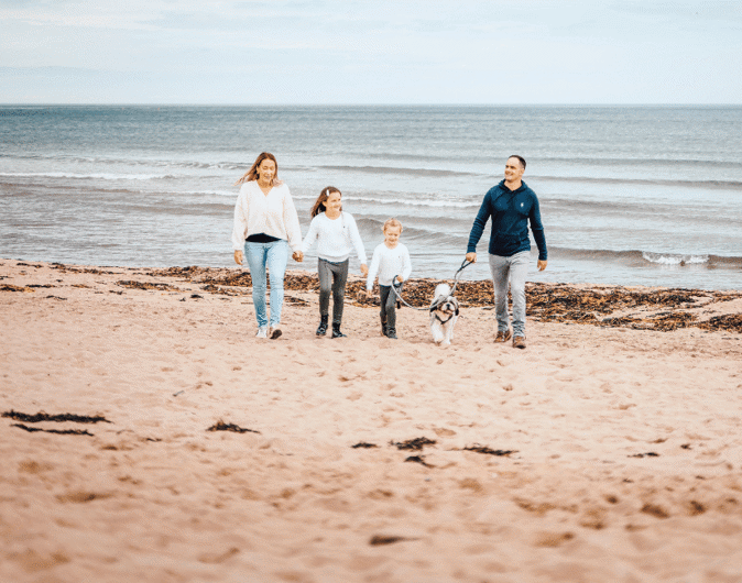 Family and dog on pease bay beach