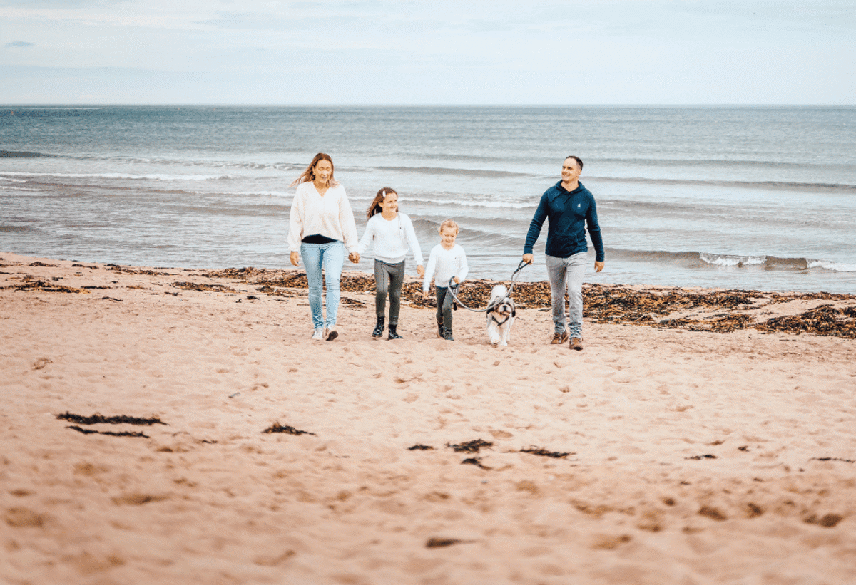 Family and dog on pease bay beach