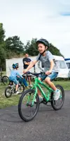 Child on bike in touring field