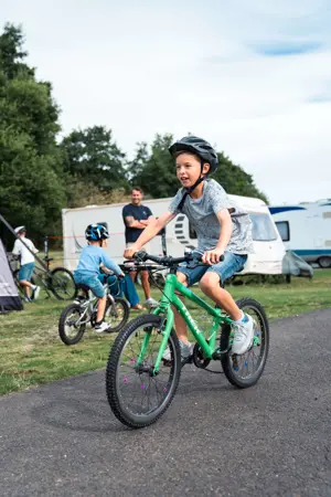 Child on bike in touring field