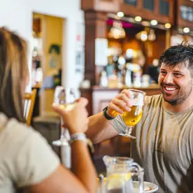 Couple enjoying a drink at Thurston Manor Leisure Park