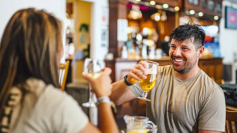 Couple enjoying a drink at Thurston Manor Leisure Park
