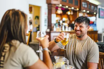 Couple enjoying a drink at Thurston Manor Leisure Park
