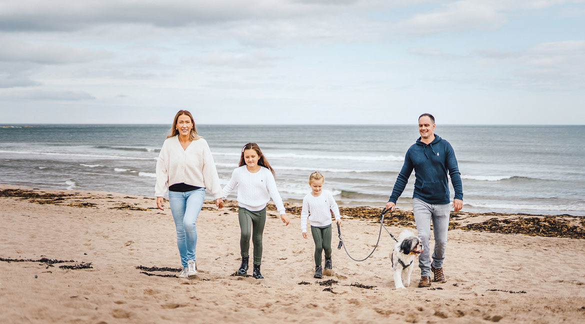 Coldingham Bay beach family with dog