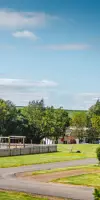 Outdoor play area and clubhouse facilities at Thurston Manor 