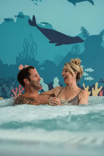 Couple in whirlpool bath at Riverside