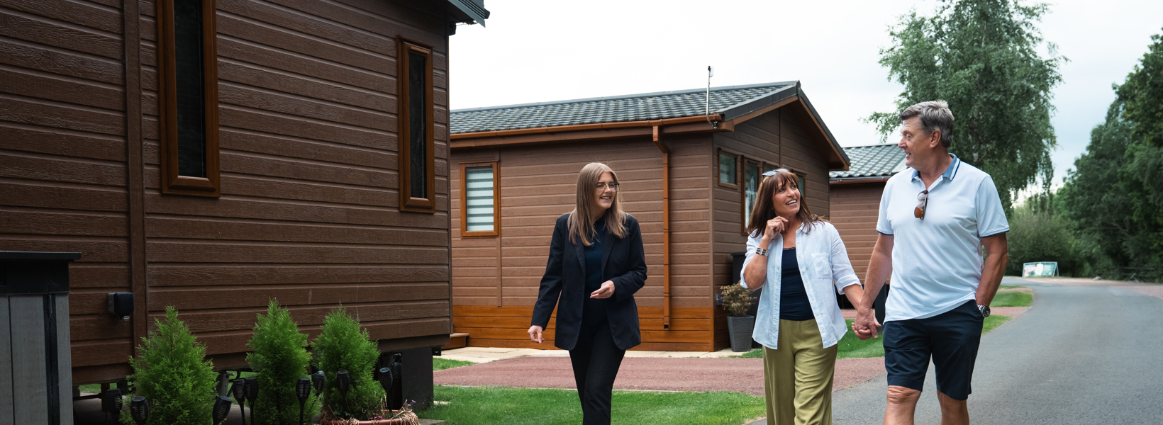 People being shown around holiday park
